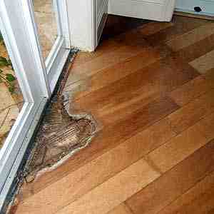 How do you dry wet wood?