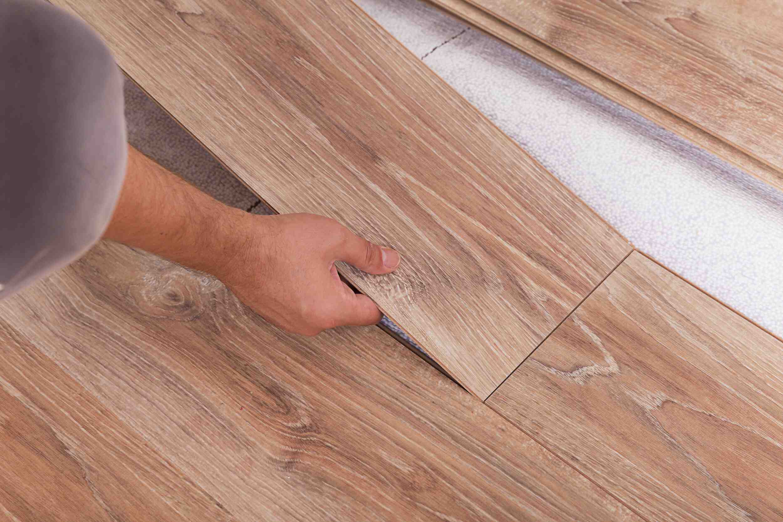 How do you fix a swollen wood floor?