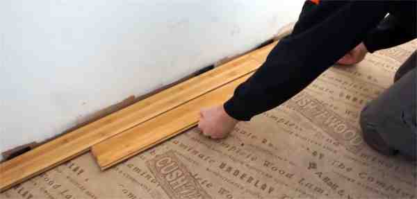 Which way should you lay flooring in Long room?