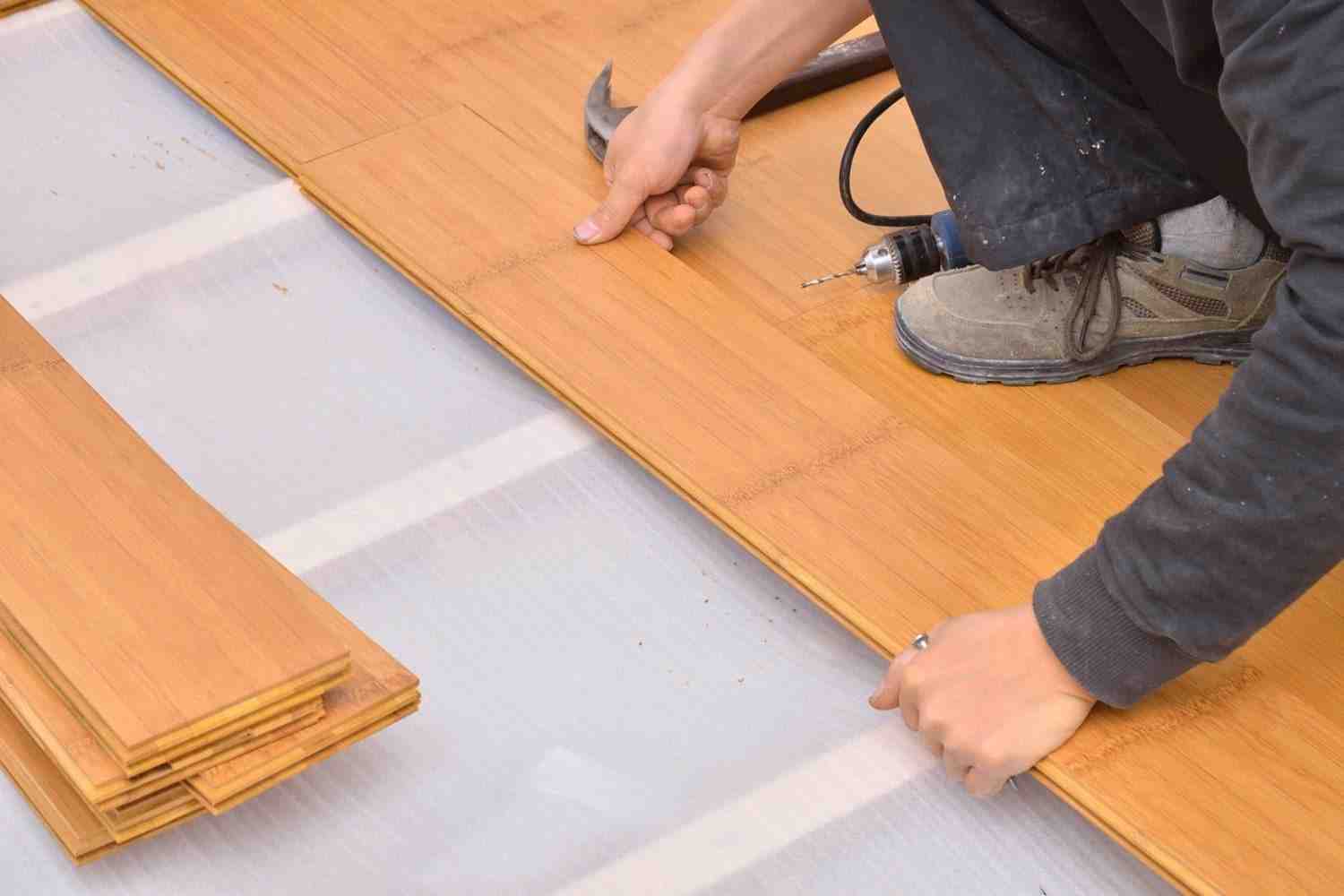 What do you put on concrete floor before laminate?