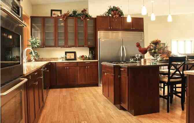 Can you put new kitchen floor without removing cabinets?