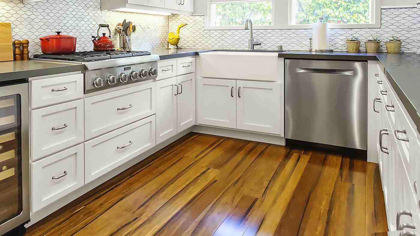 What holds a floating floor in place?